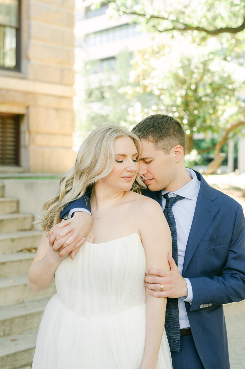 bride and groom posing for Houston wedding photographer