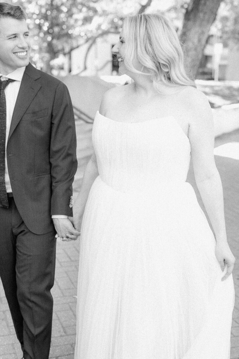 bride and groom walking in downtown Houston after their micro wedding