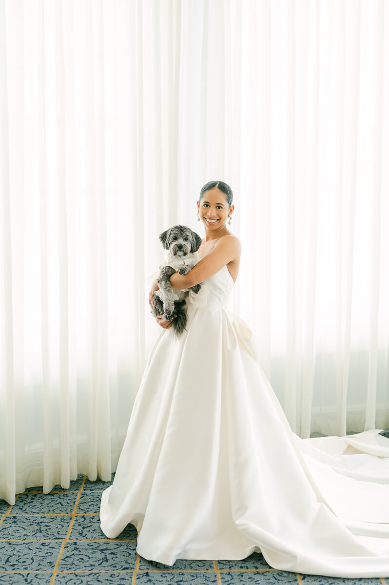 bride with her dog at the grand galvez hotel