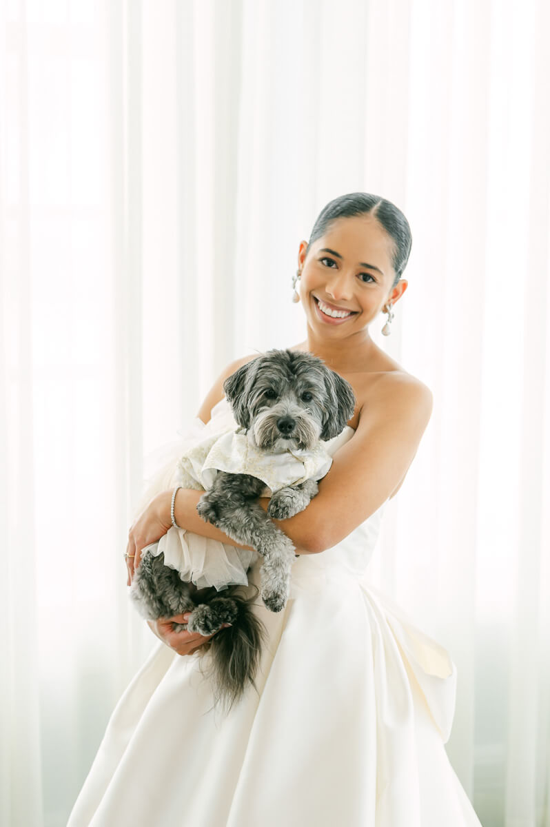 bride with her dog at the grand galvez hotel