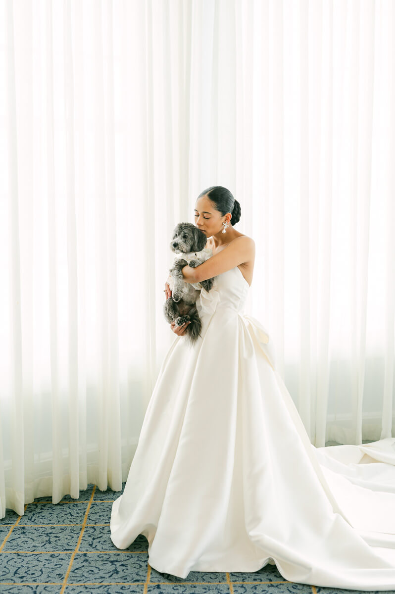 bride with her dog at the grand galvez hotel