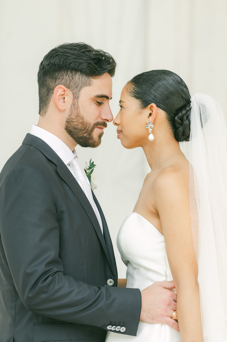 bride and groom posing for Galveston wedding photographer