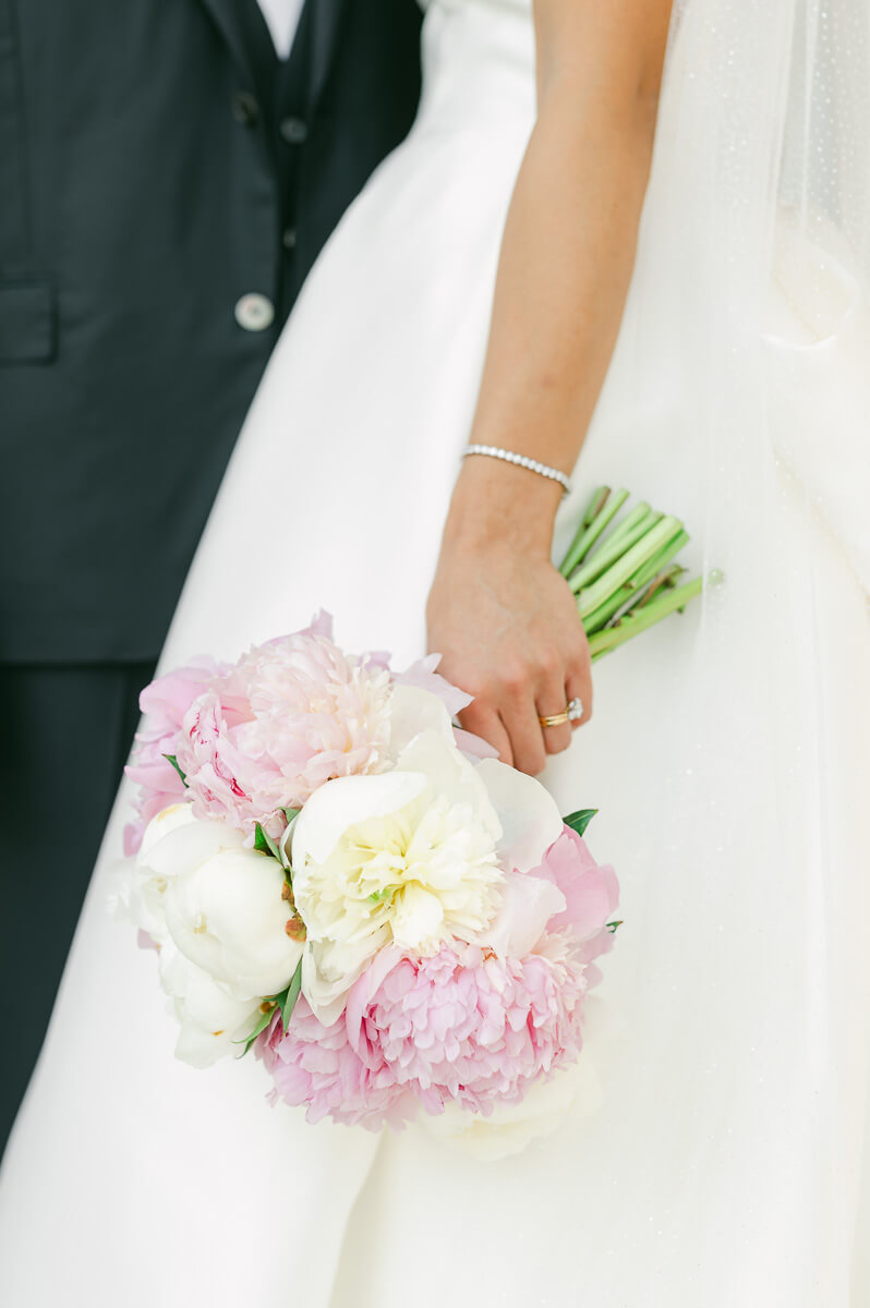 bride and groom posing for Galveston wedding photographer