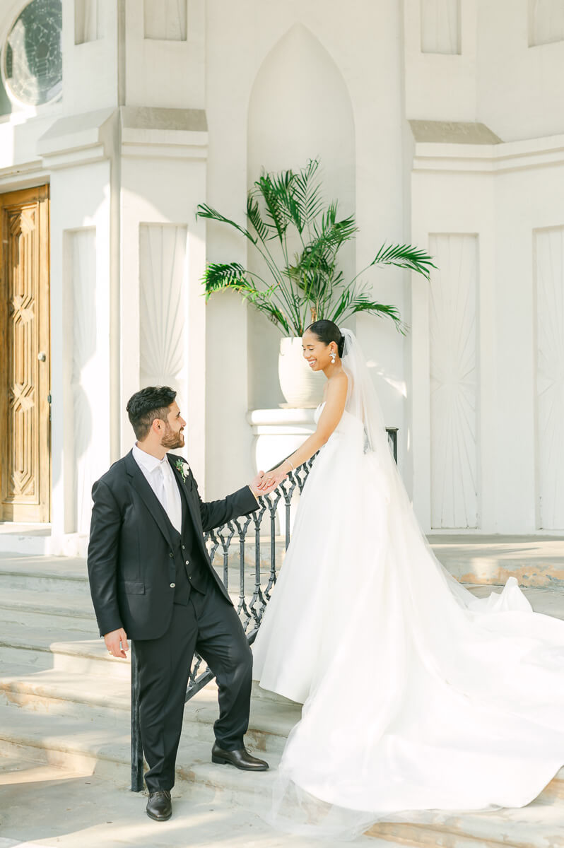 bride and groom posing for Galveston wedding photographer