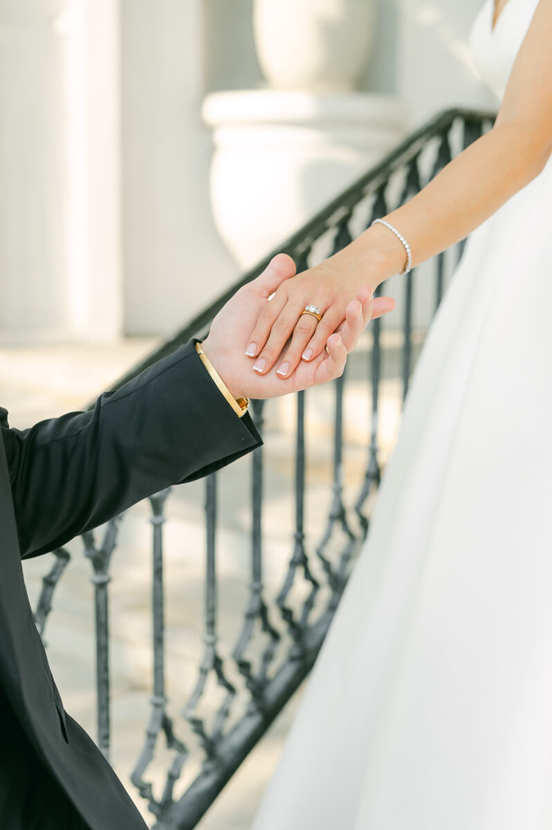 bride and groom posing for Galveston wedding photographer