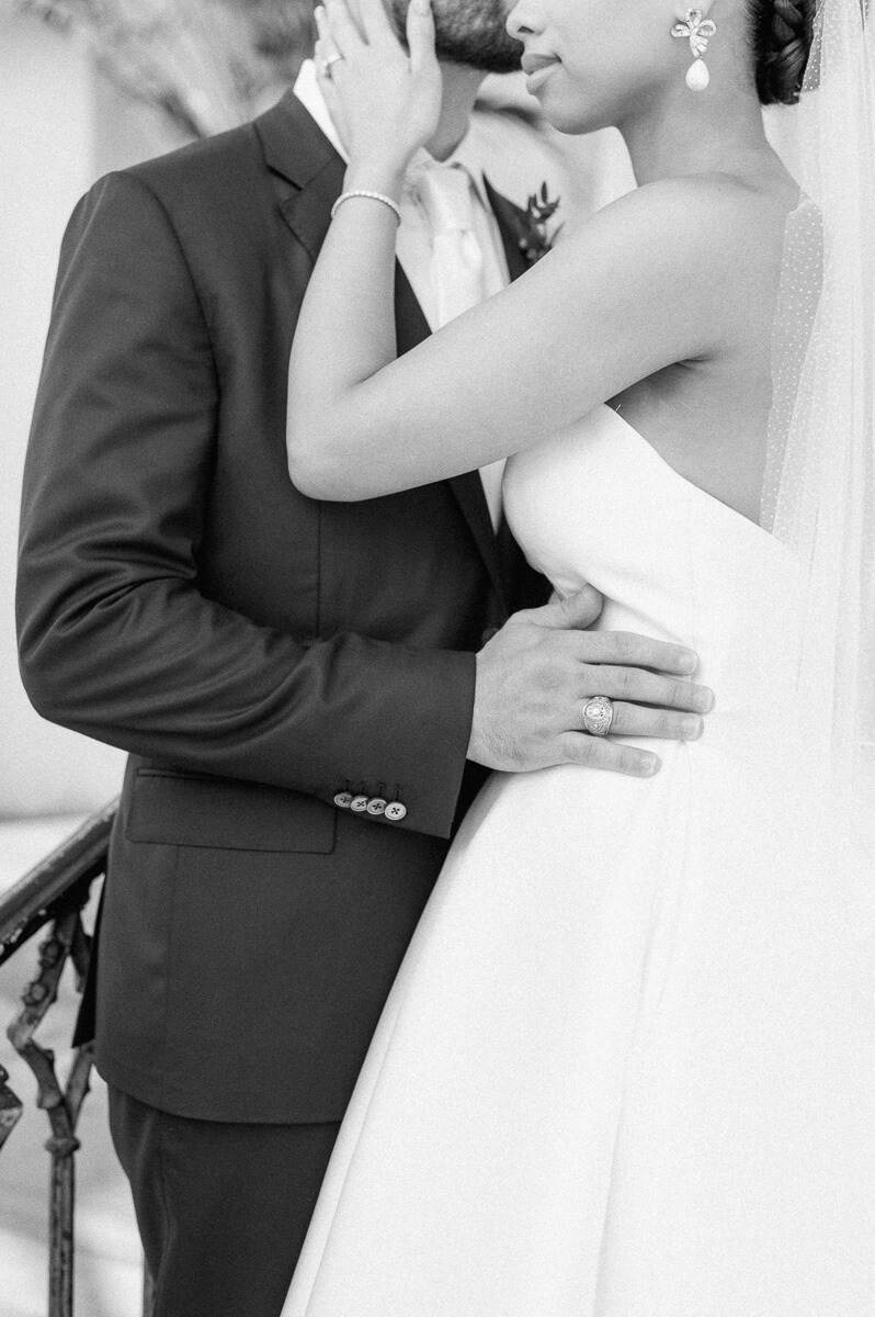 bride and groom posing for Galveston wedding photographer