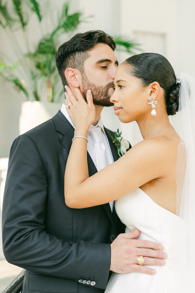 bride and groom posing for Galveston wedding photographer