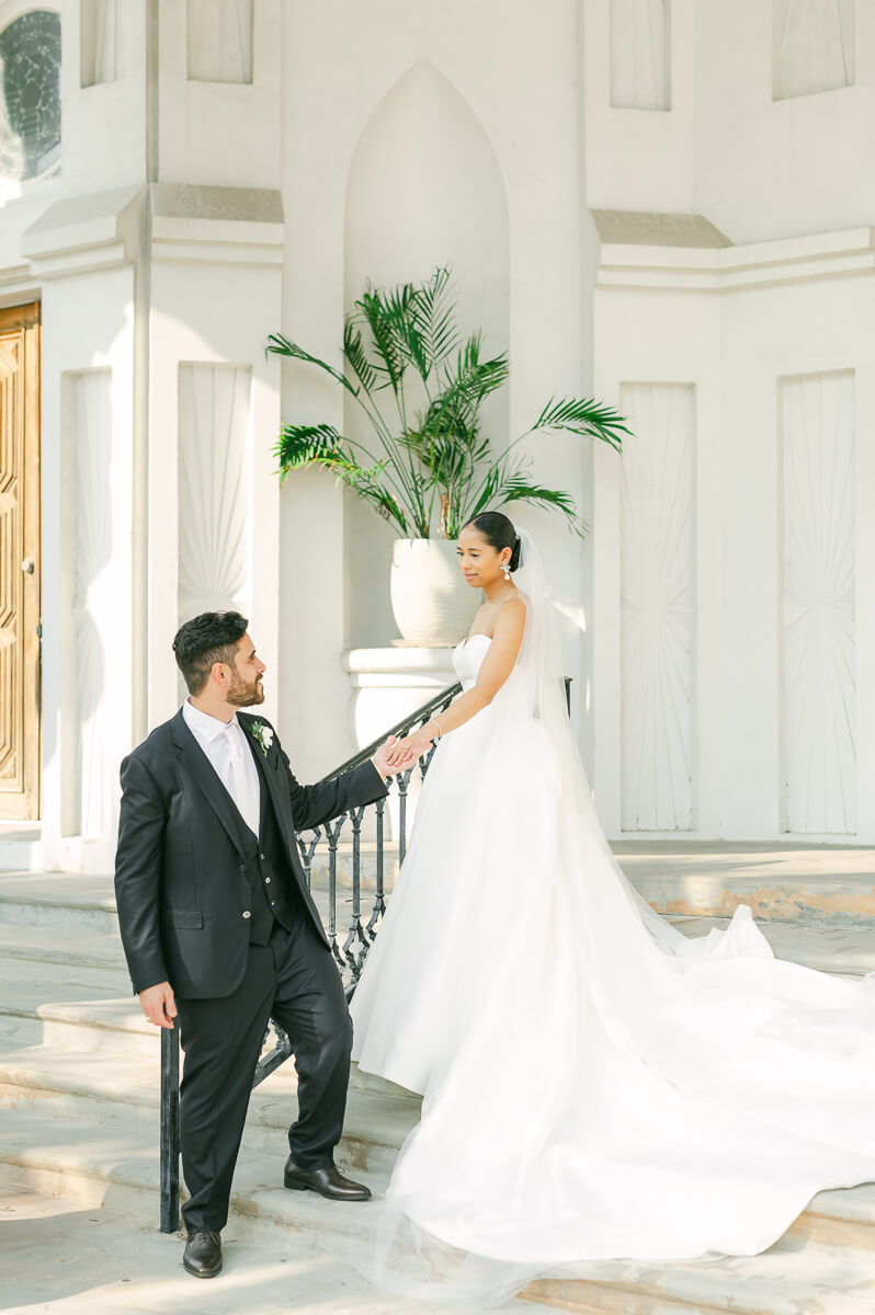 bride and groom posing for Galveston wedding photographer