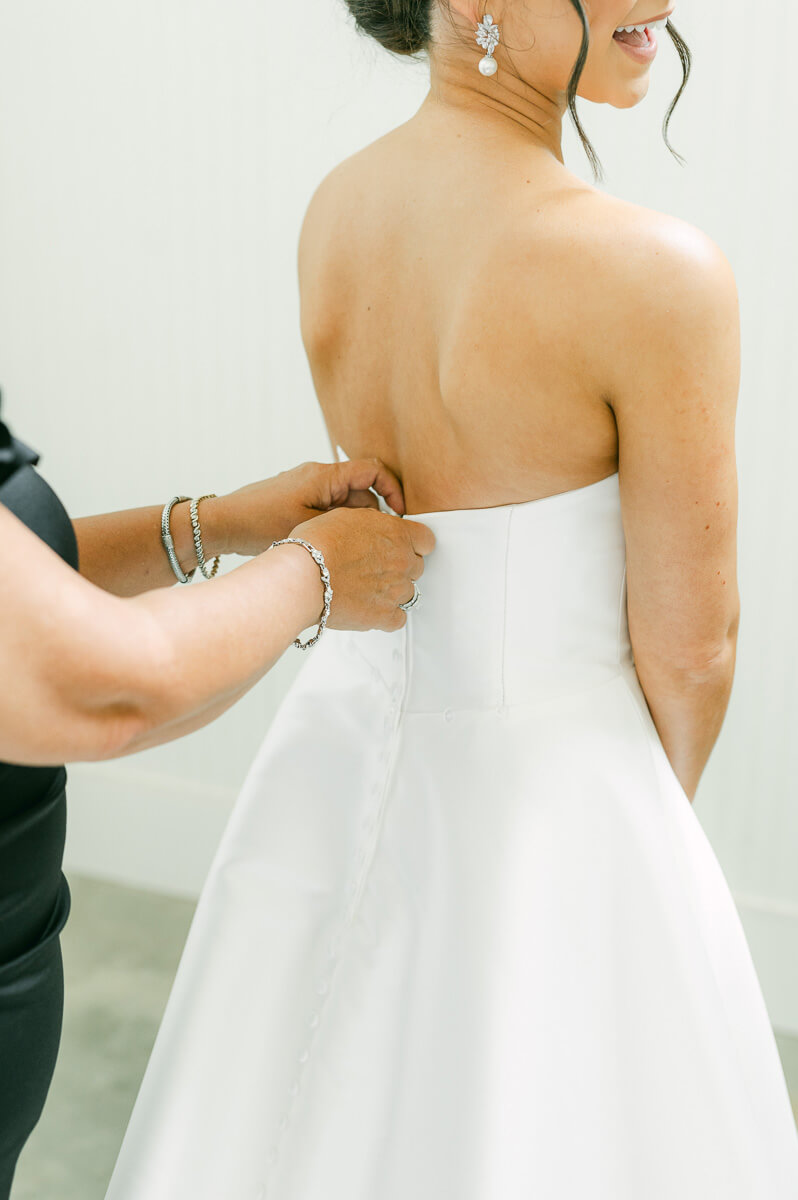 bride getting ready by Conroe wedding photographer