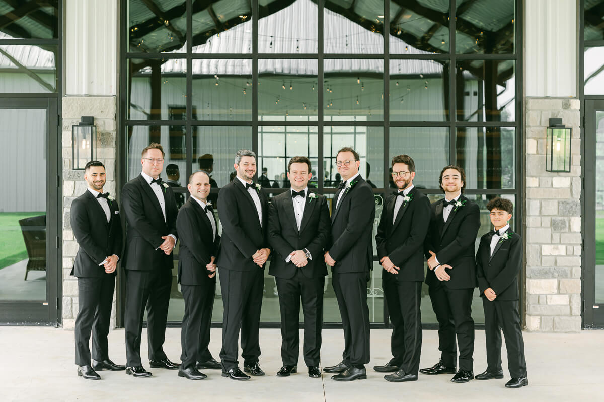 groomsmen outside Grand Pines Reserve in Conroe, Tx