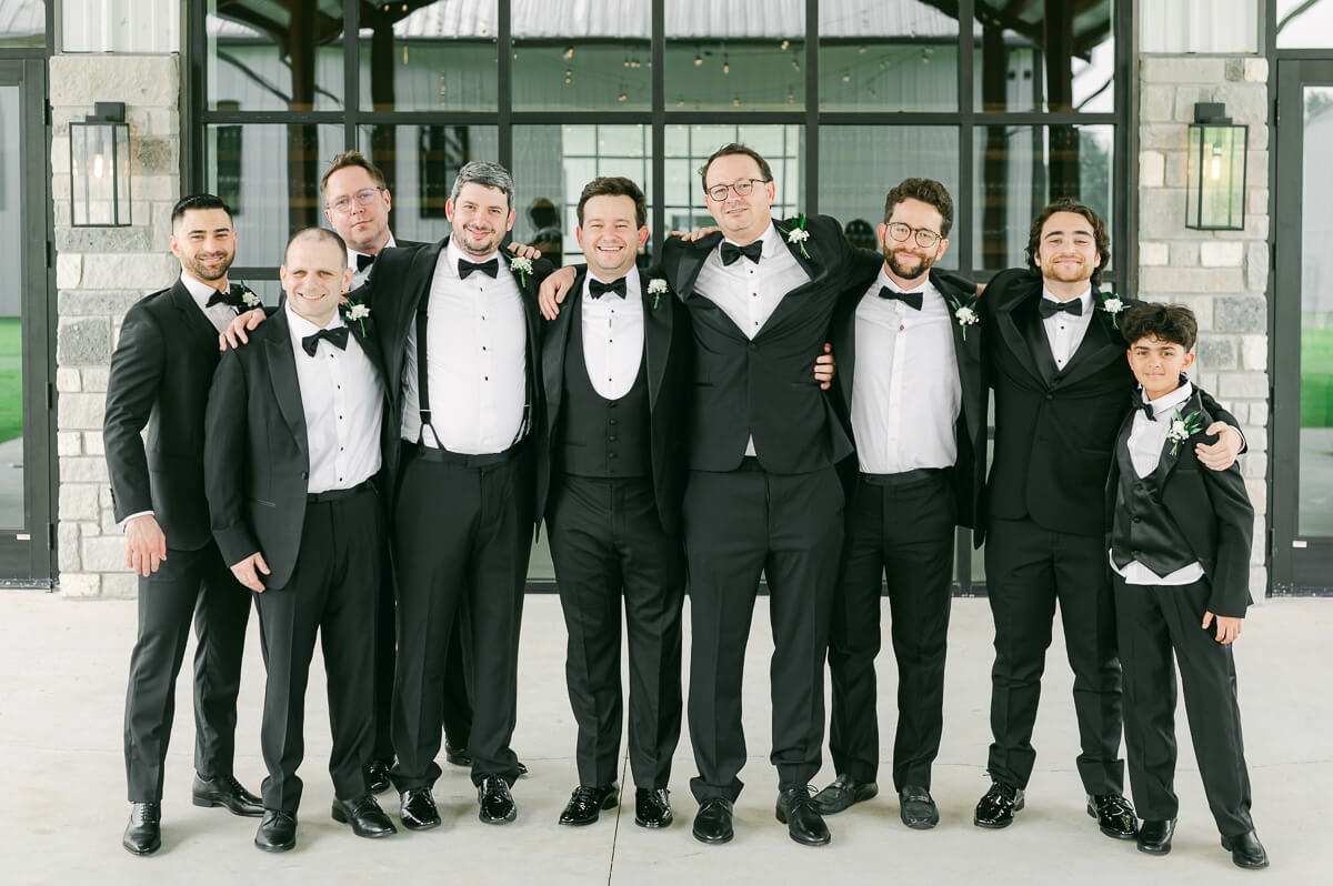 groomsmen outside Grand Pines Reserve in Conroe, Tx