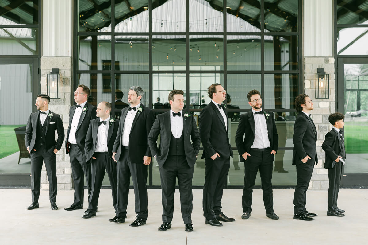 groomsmen outside Grand Pines Reserve in Conroe, Tx