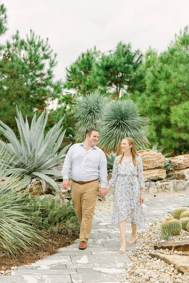 couple walking at their Houston engagement session