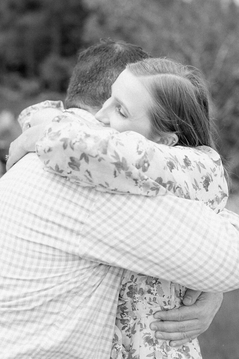 black and white photo of couple hugging during their engagement session