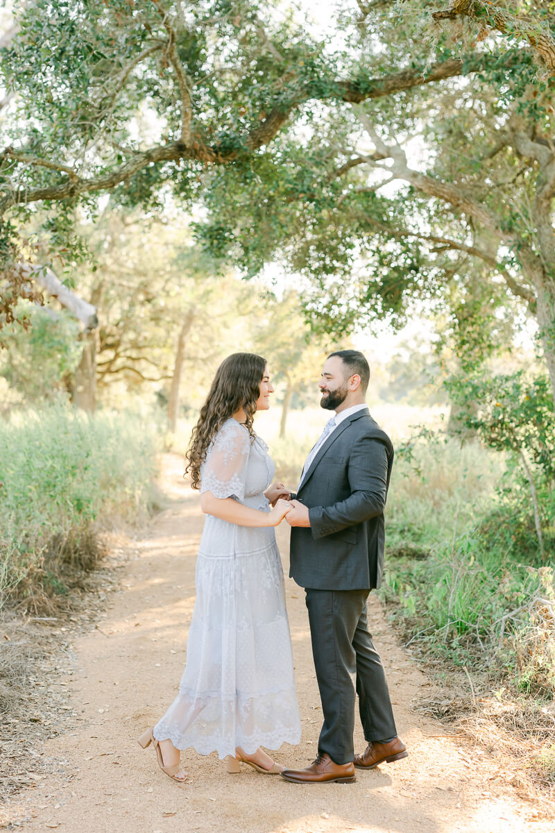 engaged couple dancing at their brazos bend engagement session 