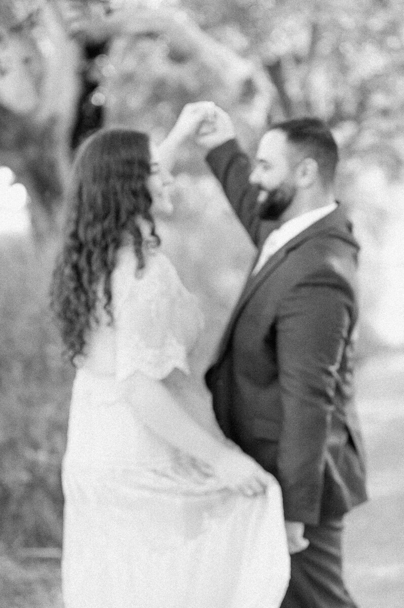 engaged couple dancing at their brazos bend engagement session 