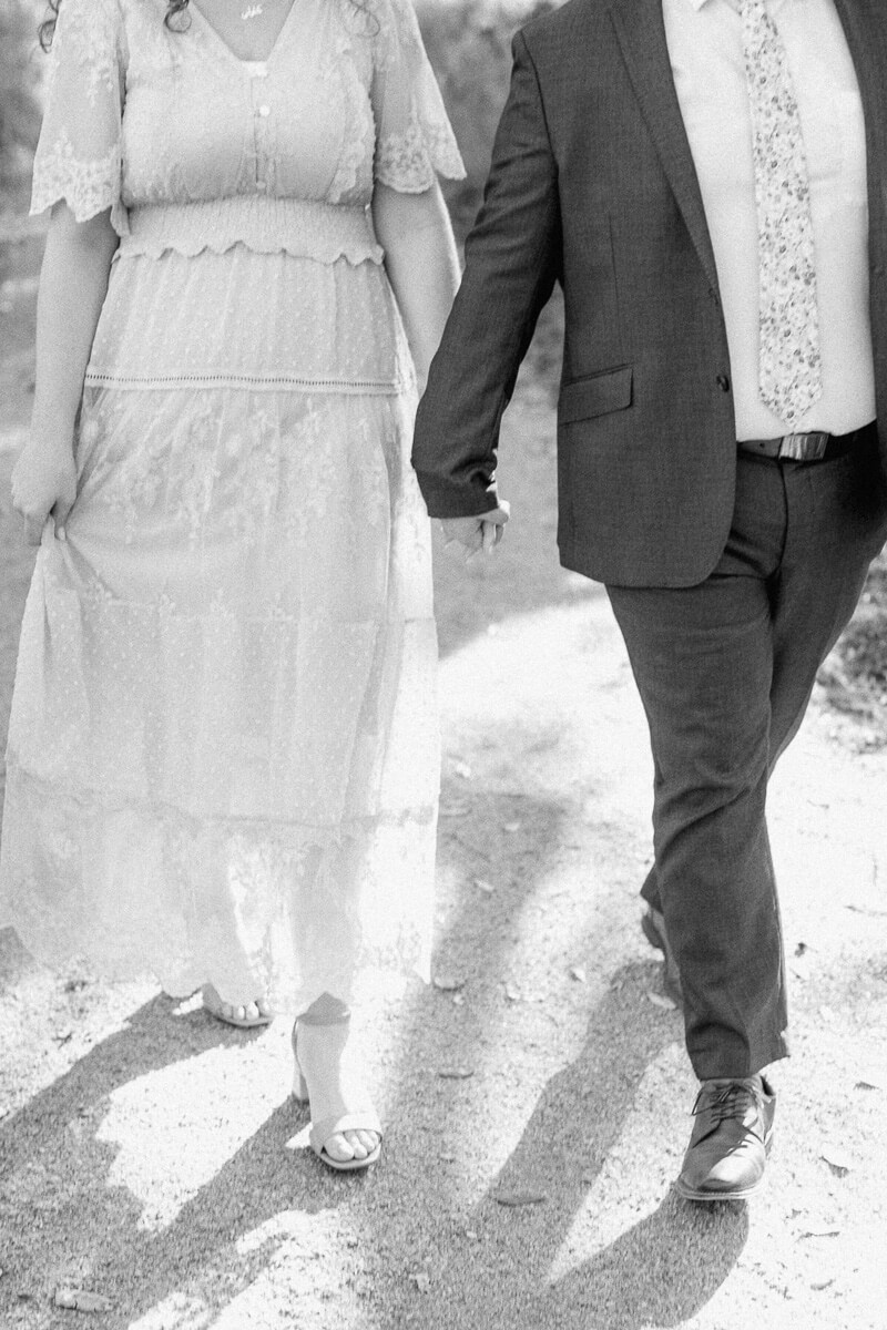 engaged couple walking at their brazos bend engagement session 
