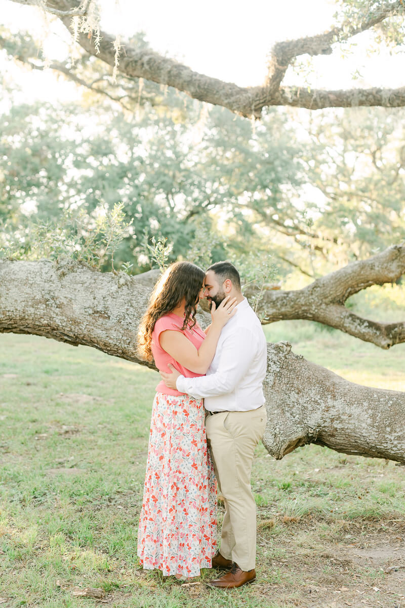 pink floral dress at engagement session in houston, texas