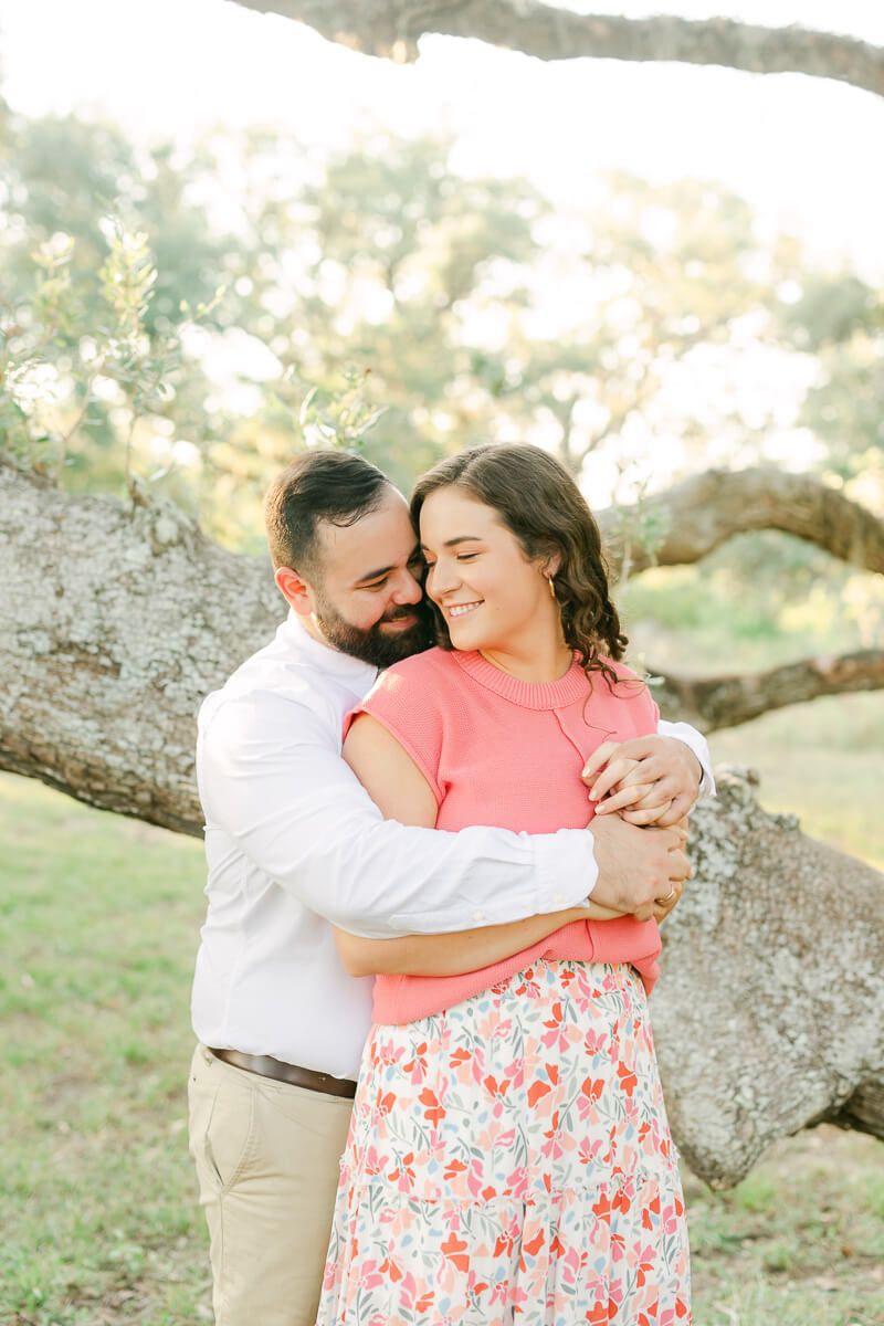 pink floral dress at engagement session in houston, texas