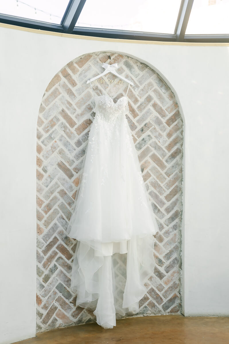 wedding dress hanging in Iron Manor bridal room 