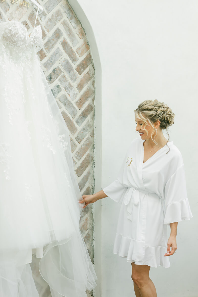 bride getting ready in the Iron Manor bridal suite