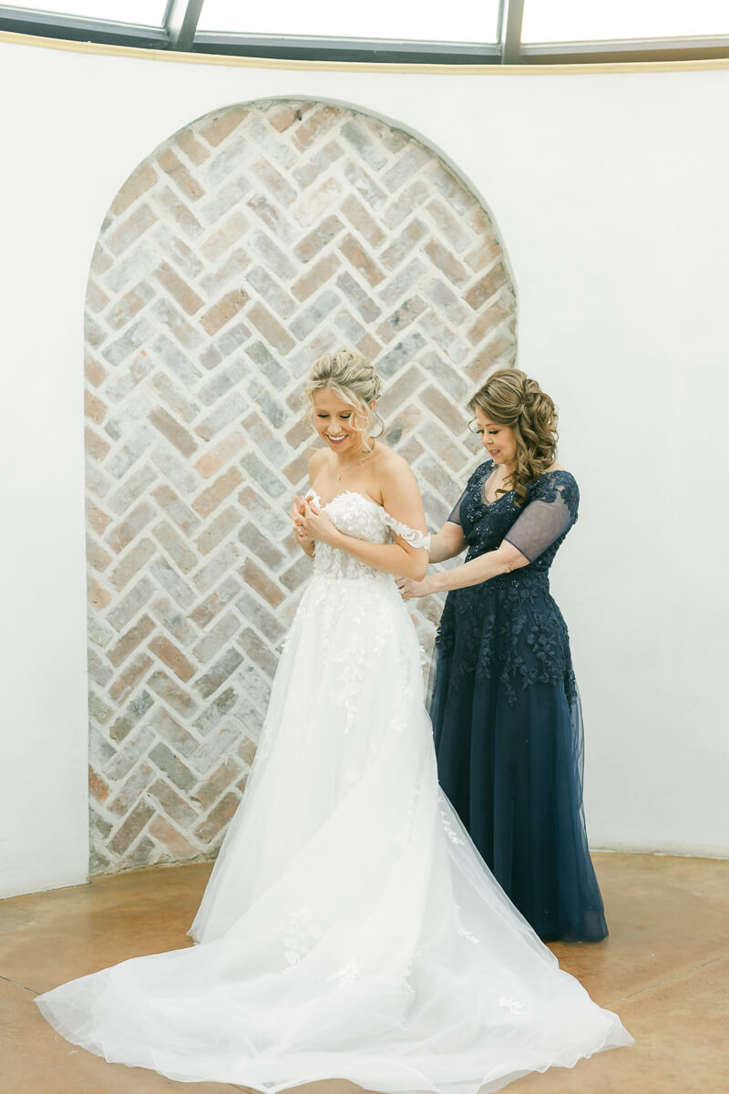 bride getting ready in the Iron Manor bridal suite