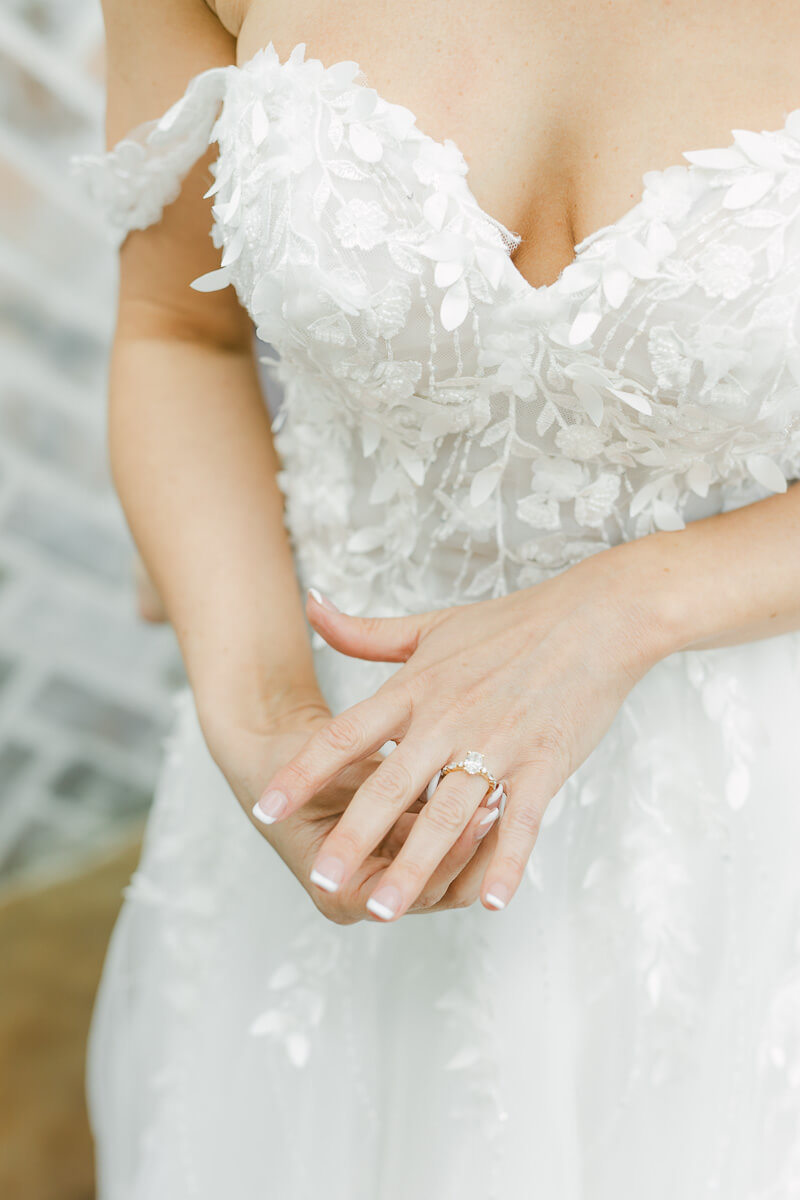 photo of bride fixing her wedding ring in Montgomery, Texas 