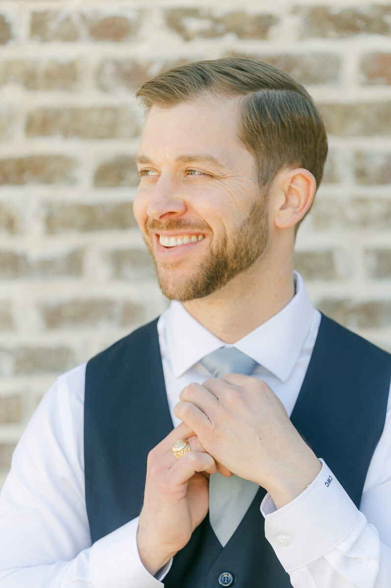 groom getting ready outside Iron Manor wedding venue