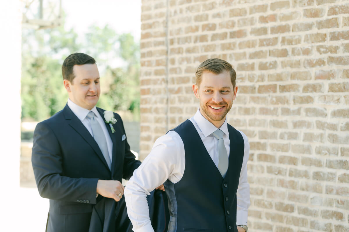 groom getting ready outside Iron Manor wedding venue