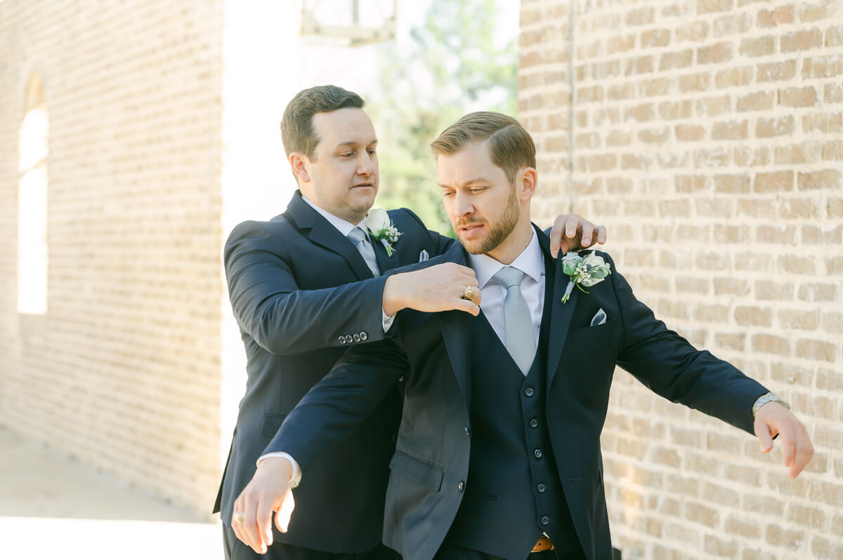 groom getting ready outside Iron Manor wedding venue