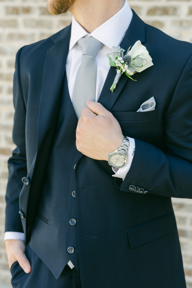 groom's watch and boutonniere on his wedding day in Montgomery, Texas