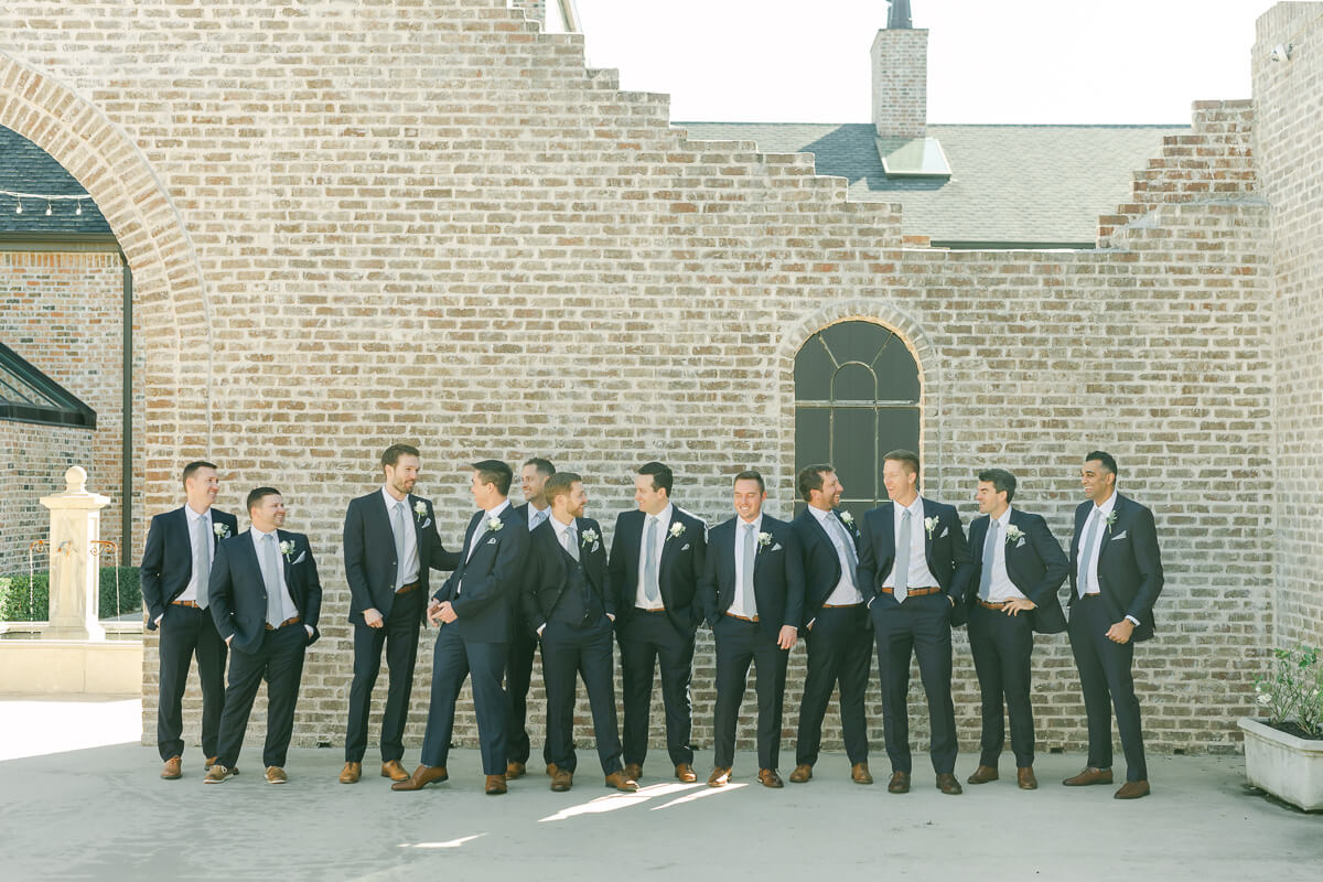 groomsmen in dark blue suits