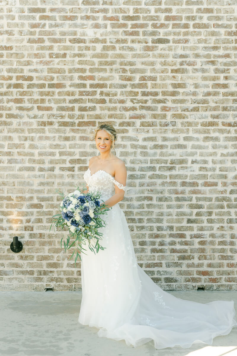 bride posing at her wedding shot by Montgomery wedding photographer