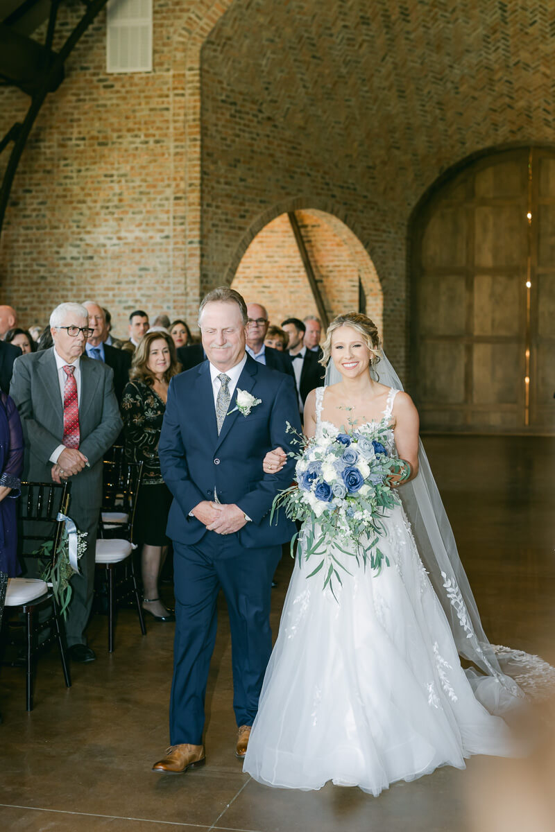 bride walking down the aisle at Iron Manor
