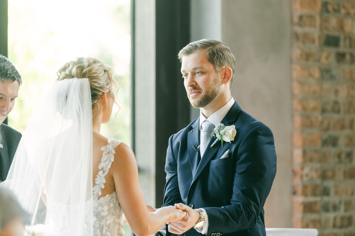 groom during indoor wedding ceremony in Montgomery, Texas