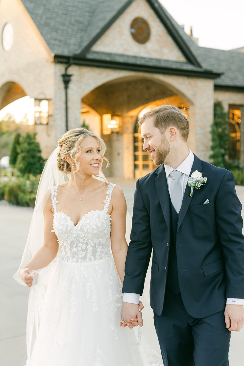 couple walking outside Iron Manor wedding venue