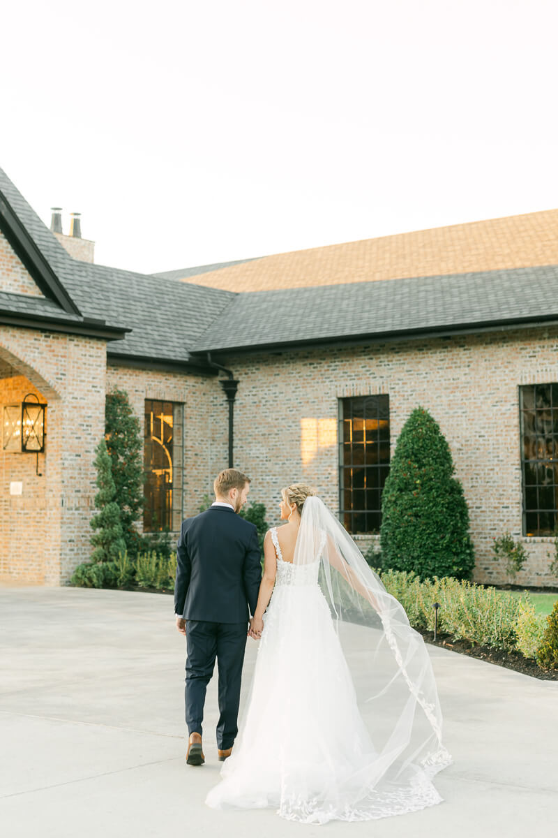 couple walking outside Iron Manor wedding venue