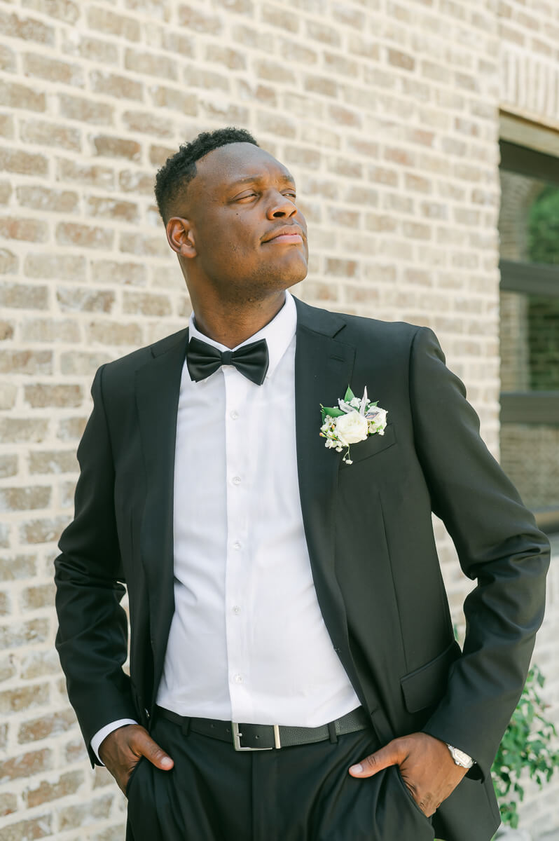 groom posing for Montgomery, Tx wedding photographer 