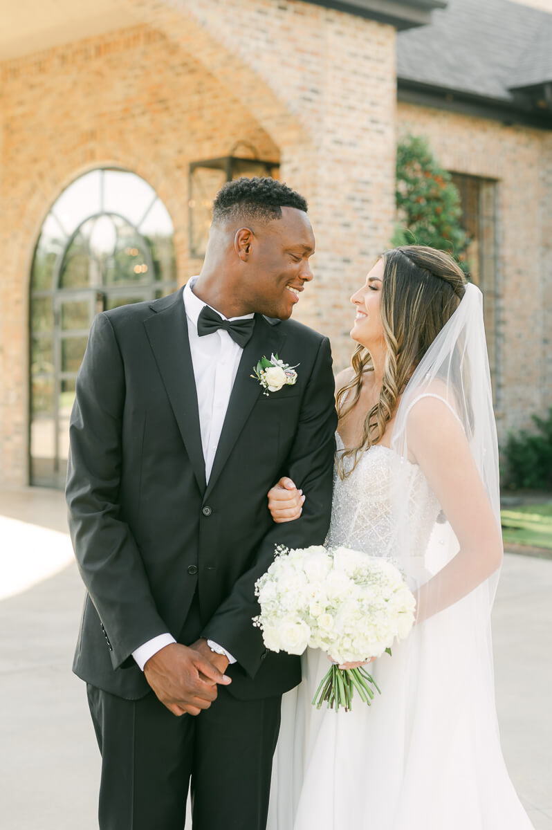 bride and groom posing for Montgomery, Tx wedding photographer