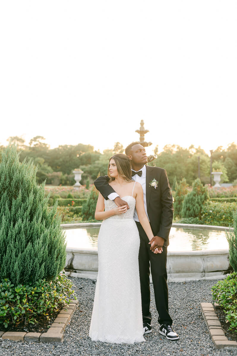 bride and groom posing for Houston wedding photographer