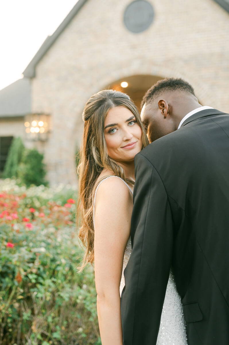 bride and groom posing for Houston wedding photographer