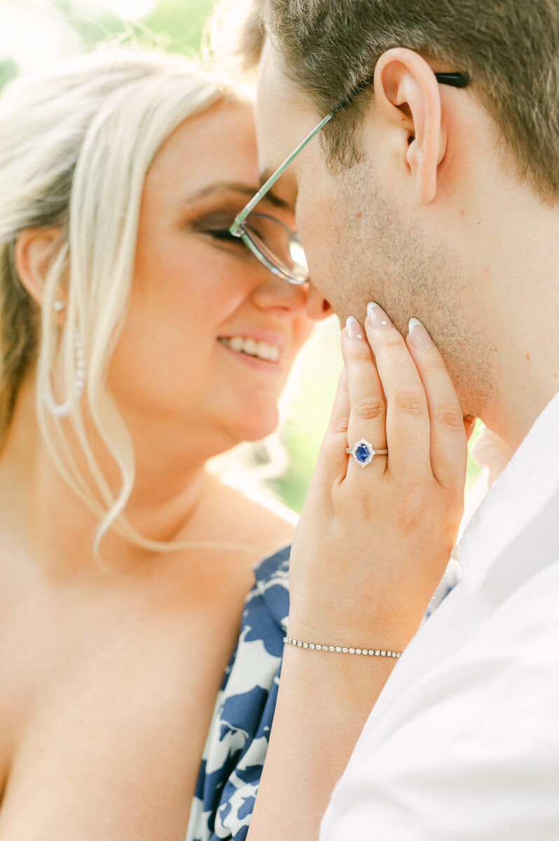 engaged couple with blue engagement ring