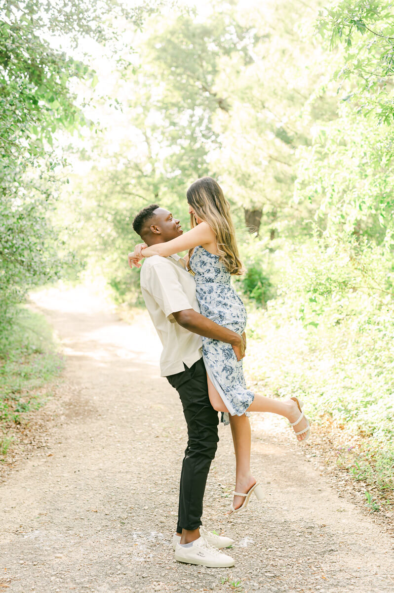 engaged couple spinning during Houston engagement session
