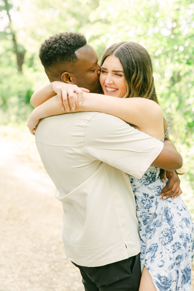 engaged couple spinning during Houston engagement session