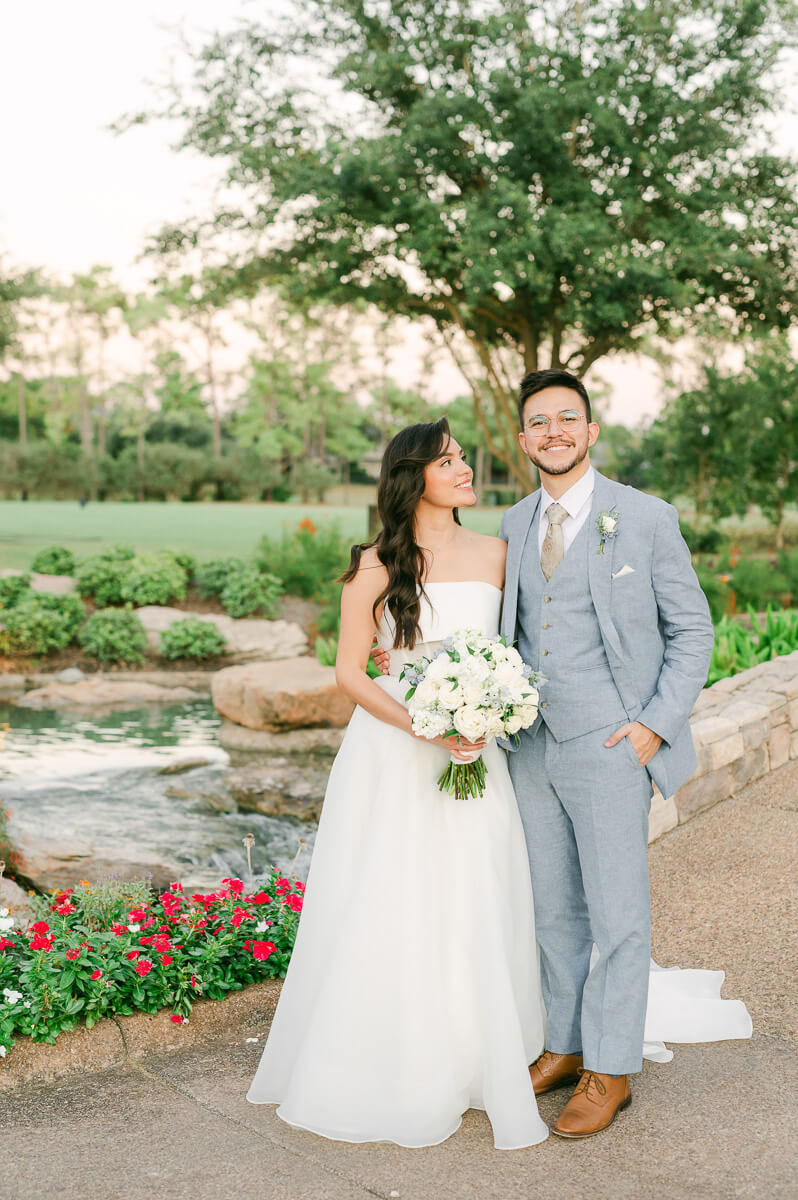 bride and groom posing for Houston wedding photographer