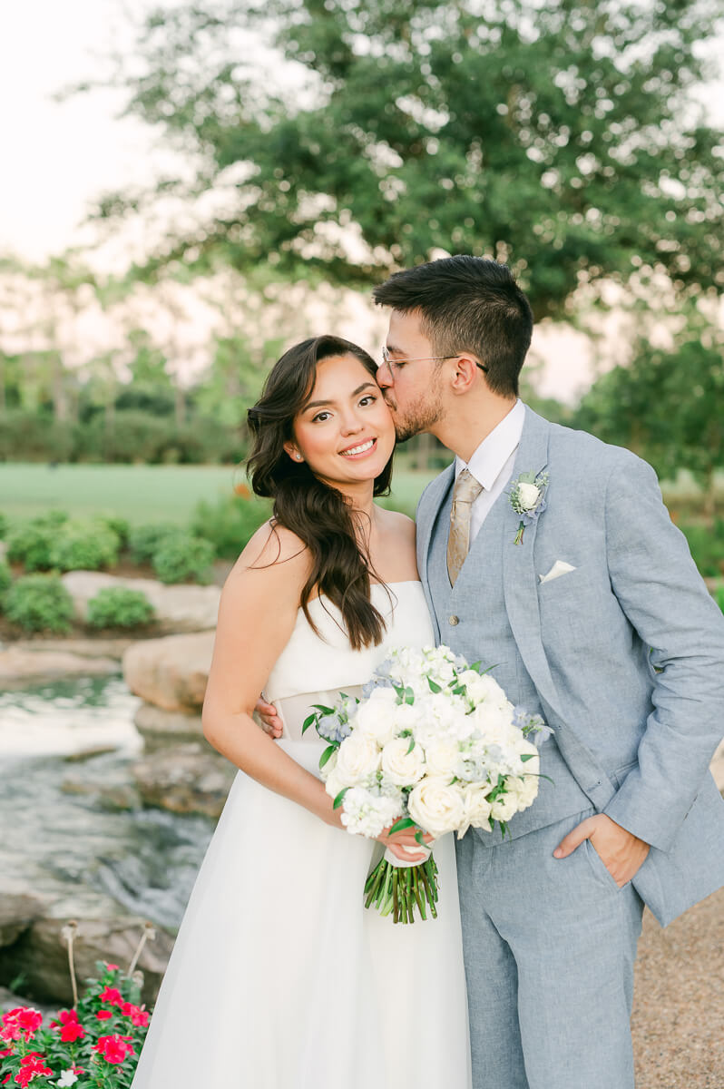 bride and groom posing for Houston wedding photographer