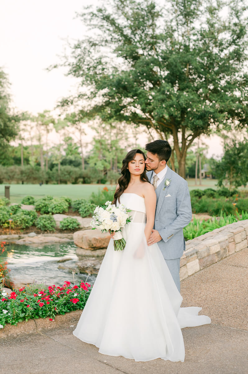 bride and groom posing for Houston wedding photographer