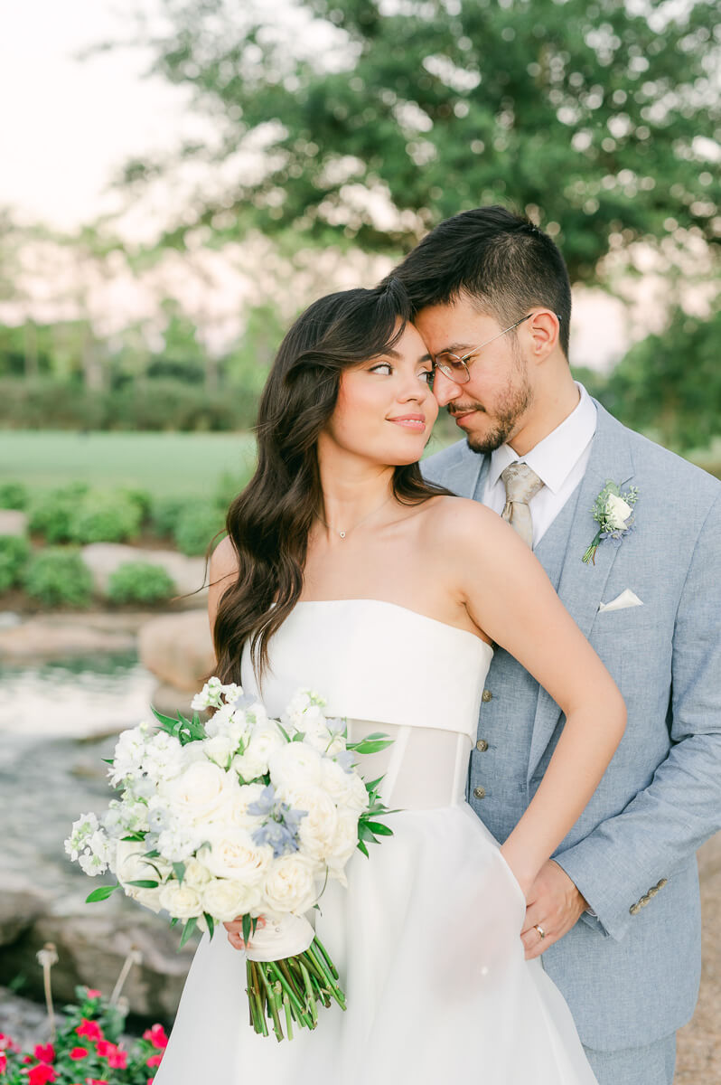 bride and groom posing for Houston wedding photographer