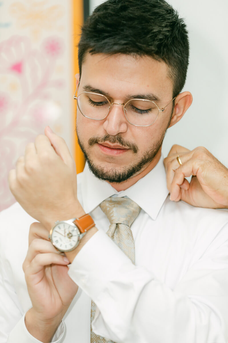 groom getting ready by Houston wedding photographer