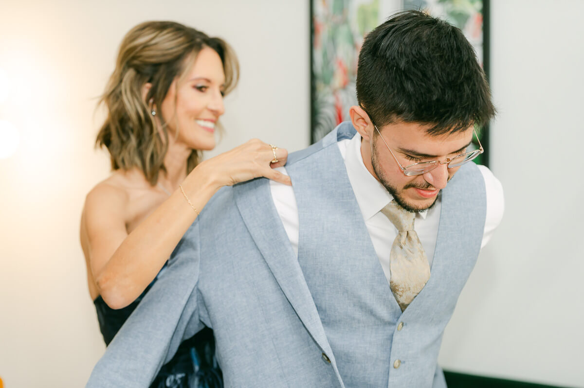 groom getting ready by Houston wedding photographer